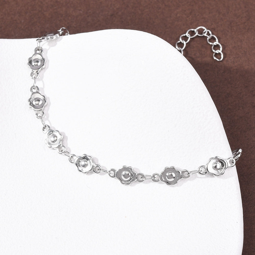 Βραχιόλι από ανοξείδωτο ατσάλι με λουλούδια